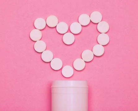 Take care of your heart health. Studio shot of pills forming a heart against a Stock Photos