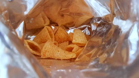 Take chips from a plastic package Stock-Footage 101035467