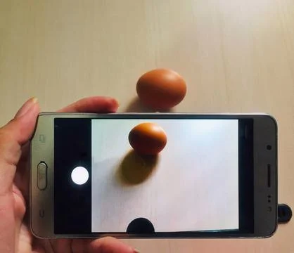 Take a close-up shot of an object using a mobile camera. Stock Photos