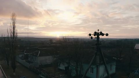 Take-off of the copter through the electric wires on a pole in the foreground Stock-Footage 130063985