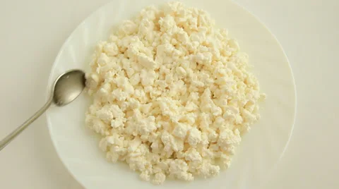To take cottage cheese a spoon Stock Footage 30597312
