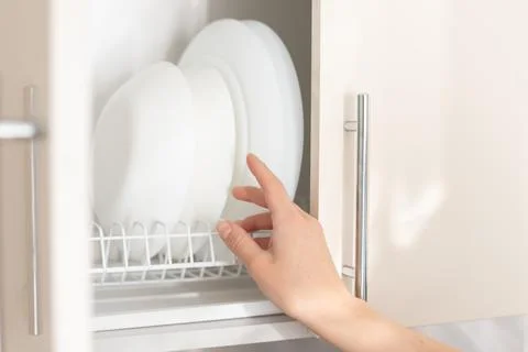 Take dishes in the kitchen. close-up Foto stock