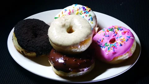 Take donut from the plate Stock Footage 215388967