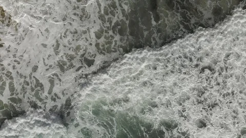 The take-off of a drone over the waves and the beach during a storm Stock Footage 97265046