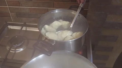 Take the dumplings out of the pan Stock Footage 244600190