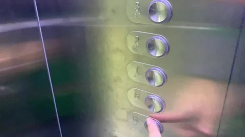 Take the elevator and go down to the ground floor Stock Footage 284198423