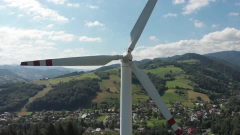 Take off in front of wind turbine Stock Footage 140070461