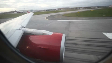 Take off of jet planewith red engine under the wing Stock Footage 98250838