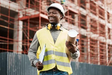 Take note of my handiwork. a male contractor holding a set of blue prints. Stock Photos