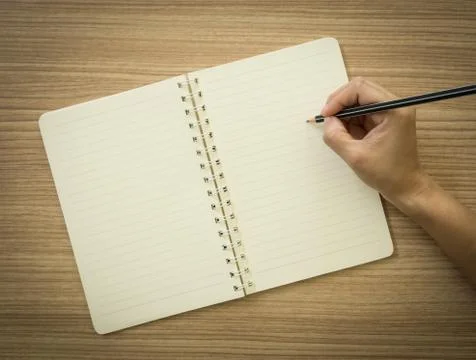 Take notes in a notebook Stock Photos