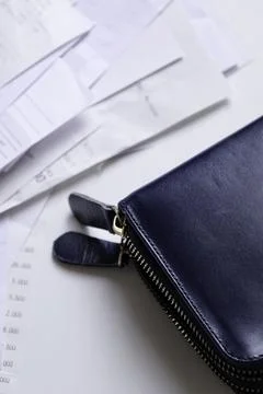Take out a stack of payment receipts from the wallet 스톡 사진