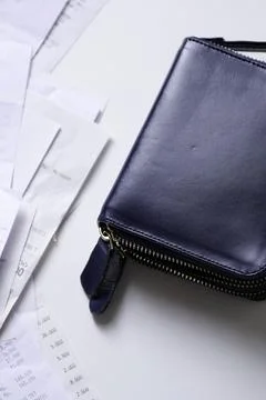 Take out a stack of payment receipts from the wallet 스톡 사진