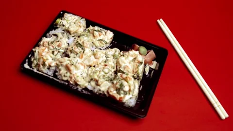 Take out Sushi Volcano Roll on a plastic container Видео 150848116