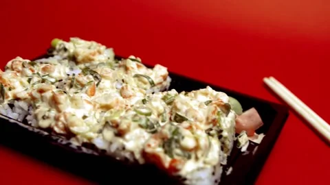 Take out Sushi Volcano Roll on a plastic container Видео 150848170