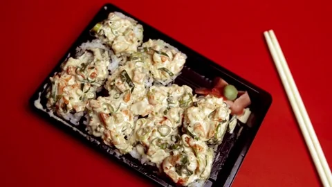 Take out Sushi Volcano Roll on a plastic container 스톡 동영상 150848289