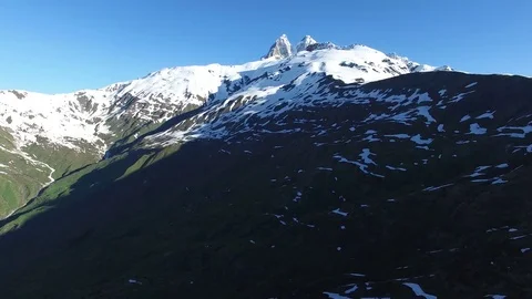 Take off over the mountain plateau next to peak of Ushba Video stock 77092822