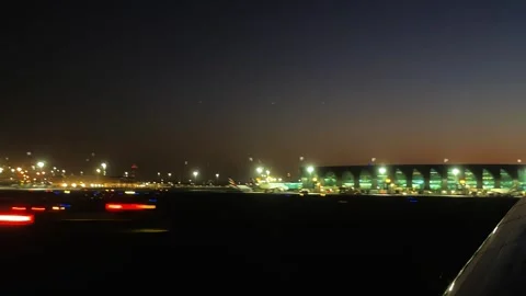 Take-off of a passenger plane at sunset at Dubai airport, timelapse Stock Footage 240134691