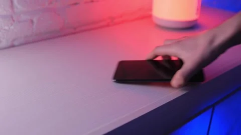 Take phone off the shelf Video stock 144983857