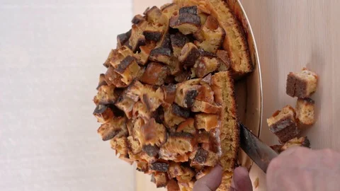 Take a piece of cake, he crumbles to pieces. Vertical shot, closeup Stock Footage 129252139