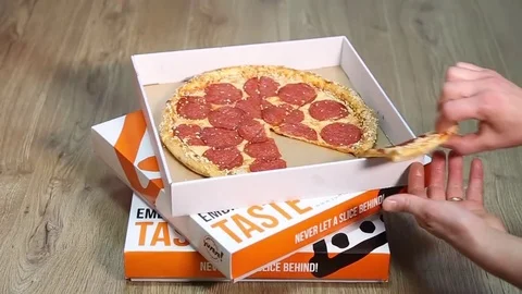 Take pizza from the box Stock Footage 83515975