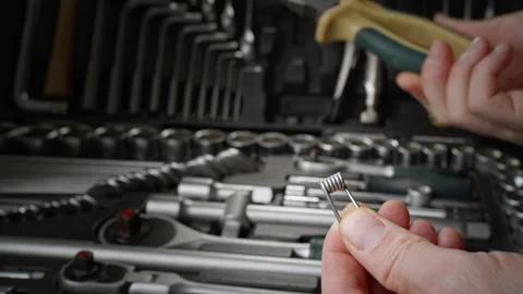 Take pliers from the toolbox and work with the spring. Pliers are a great tool Stock Footage 264096058