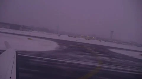 Take off Private Jet from interior in the snow Stock Footage 49660752