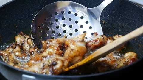 Take ripe fried chicken from boiled food oil palm Stock Footage 89514261