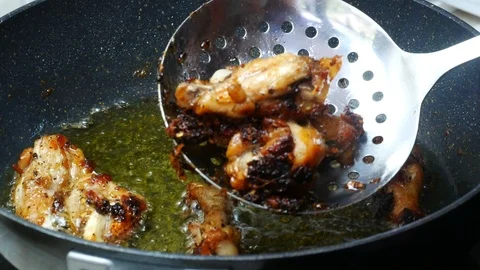 Take ripe fried chicken from boiled food oil palm Stock Footage 89514512