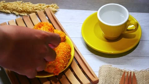 Take the risol from the plate on the table Stock Footage 215632128