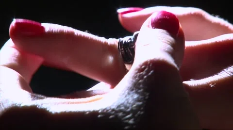 Take off rough ring with silver skull on girl hand, black smoke Video stock 68213267