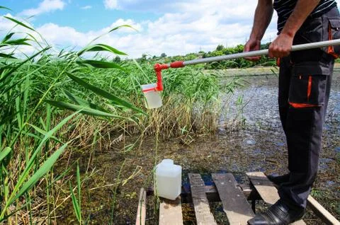 Take samples of water for laboratory testing. The concept - analysis of water Stock Photos