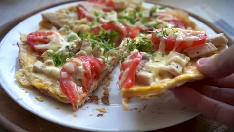 Take a slice of pizza on a pita bread with chicken, tomatoes and stretching chee Stock Footage 131673053