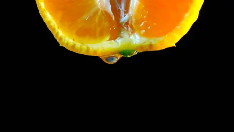 Take a slow motion video of falling water drops from a mandarin orange. 스톡 동영상 145349957