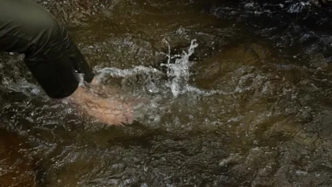 Take slow shots using your legs to hit the water at the waterfall. Have fun p Stock-Footage 188426911