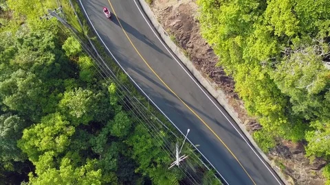 Take off from the small road through the rainforest. AERIAL View Footage. Stock Footage 81353071