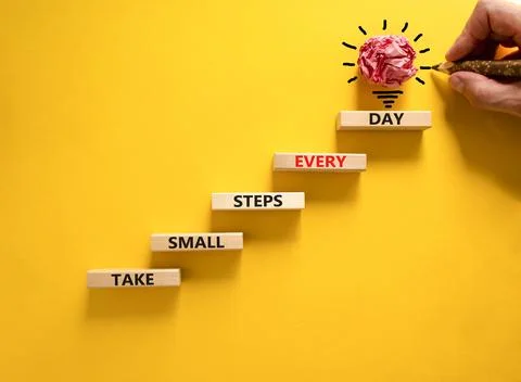 Take small steps every day symbol. Wooden blocks with words Take small steps  Stock Photos