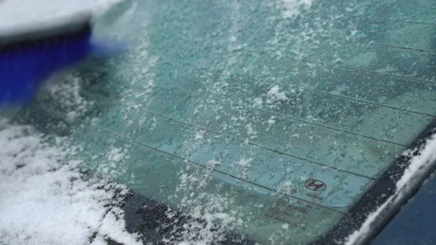 Take snow from the car Stock Footage 146635299