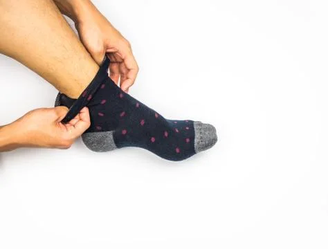 Take off sock on white background Stock Photos