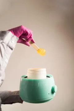 Take sugar paste from can in wax upright Stock Photos