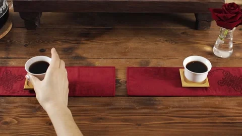 Take from the table white mugs with tea Stock Footage 139332068