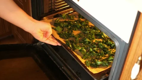 Take taking ready baked curly kale chips crispy dry dried leaves from owen 動画素材 138346381