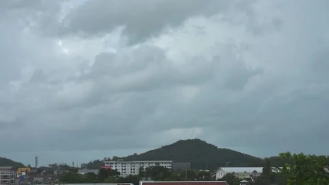 Take a time-lapse shot of rain clouds above the city Stock Footage 160750865