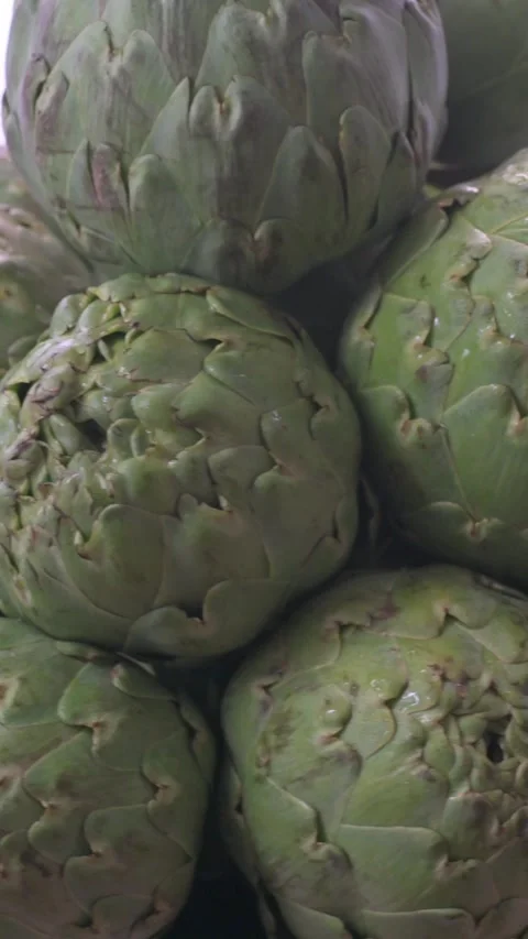 Take a vertical stack of fresh artichokes ready to cook. Stock Footage 268278734