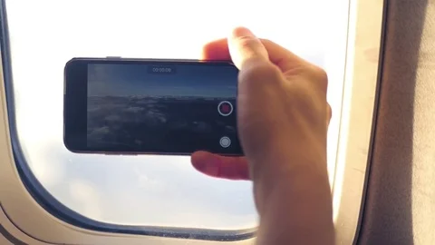 Take video of the cloud and the earth from the window of the illuminator to the Video stock 83344153