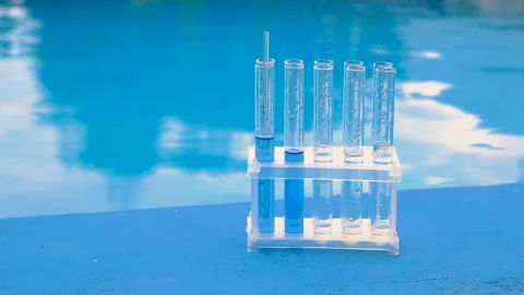 Take a water sample from the pool. Selective focus. Stock Footage 316048425