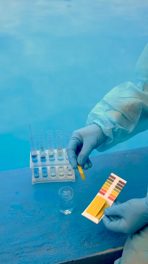 Take a water sample from the pool. Selective focus. Stock Footage 316050606