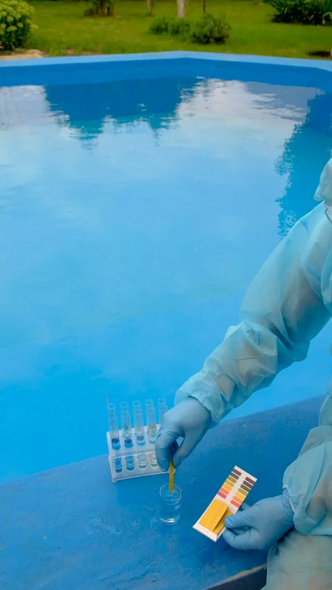 Take a water sample from the pool. Selective focus. Stock Footage 316600493