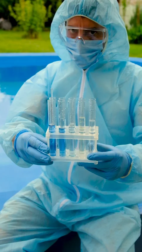 Take a water sample from the pool. Selective focus. Stock Footage 317880297