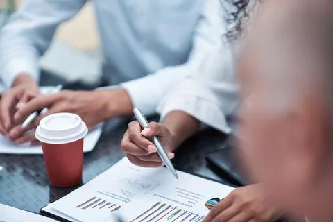 Takeaway coffee on the table with financial documents. close-up. Stock Photos