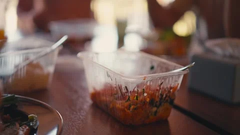 Takeaway plastic container with fresh vegetable salad on wooden tables Stock Footage 336397547